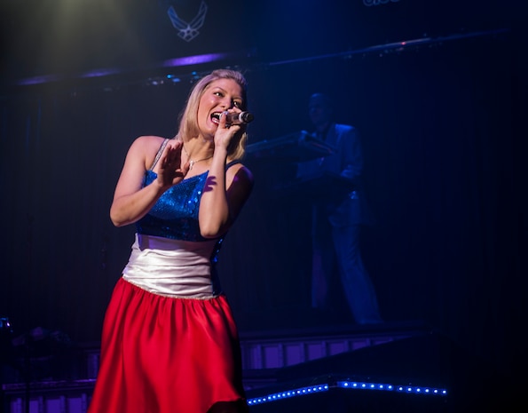 Senior Airman Joleen Dedmon performs during the Tops in Blue concert Jan. 9, 2013, at the North Charleston Performing Arts Center, S.C. Tops in Blue is an expeditionary entertainment unit that provides quality entertainment for the service members and their families stationed worldwide and at remote and deployed locations, while simultaneously promoting community relations, supporting recruiting efforts and serving as ambassadors for the United States of America and the U.S. Air Force. (U.S. Air Force photo/Airman 1st Class Ashlee Galloway)