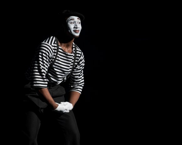 Airman 1st Class Jonathan Leak performs as a mime at the Tops in Blue show Jan. 9, 2013, at the North Charleston Performing Arts Center, S.C. Composed of 35 to 40 vocalists, musicians, dancers and technicians , the group’s primary mission is to perform for military personnel and their families around the world. This year's tour took Tops in Blue throughout the United States and to more than 20 countries with approximately 130 performances during a 10-month period. (U.S. Air Force photo/Airman 1st Class Ashlee Galloway)