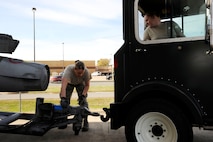 Staff Sgt. Brittany Dorsett and Senior Airman Megan Bright, 2nd Logistics Readiness Squadron shipment and distribution section, prepare to tow an external fuel tank for an F-16 Fighting Falcon in support of exercise Green Flag East on Barksdale Air Force Base, La., Jan. 11. Exercise GFE supports deploying U.S. Air Force and U.S. Army units by providing a means to rehearse close-air support operations and procedures. (U.S. Air Force photo/Airman 1st Class Andrew Moua)
