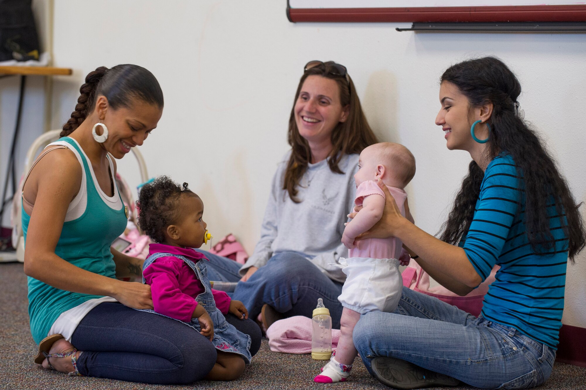 Members of the Diaper Club enjoy time with each other and their children. The Diaper Club meets Wednesdays 9:30 to 11:30 a.m. at the Shark Center located in Pelican Coast housing next to the Youth Center. For more information, please contact the New Parent Support Program at 321-494-8171.  