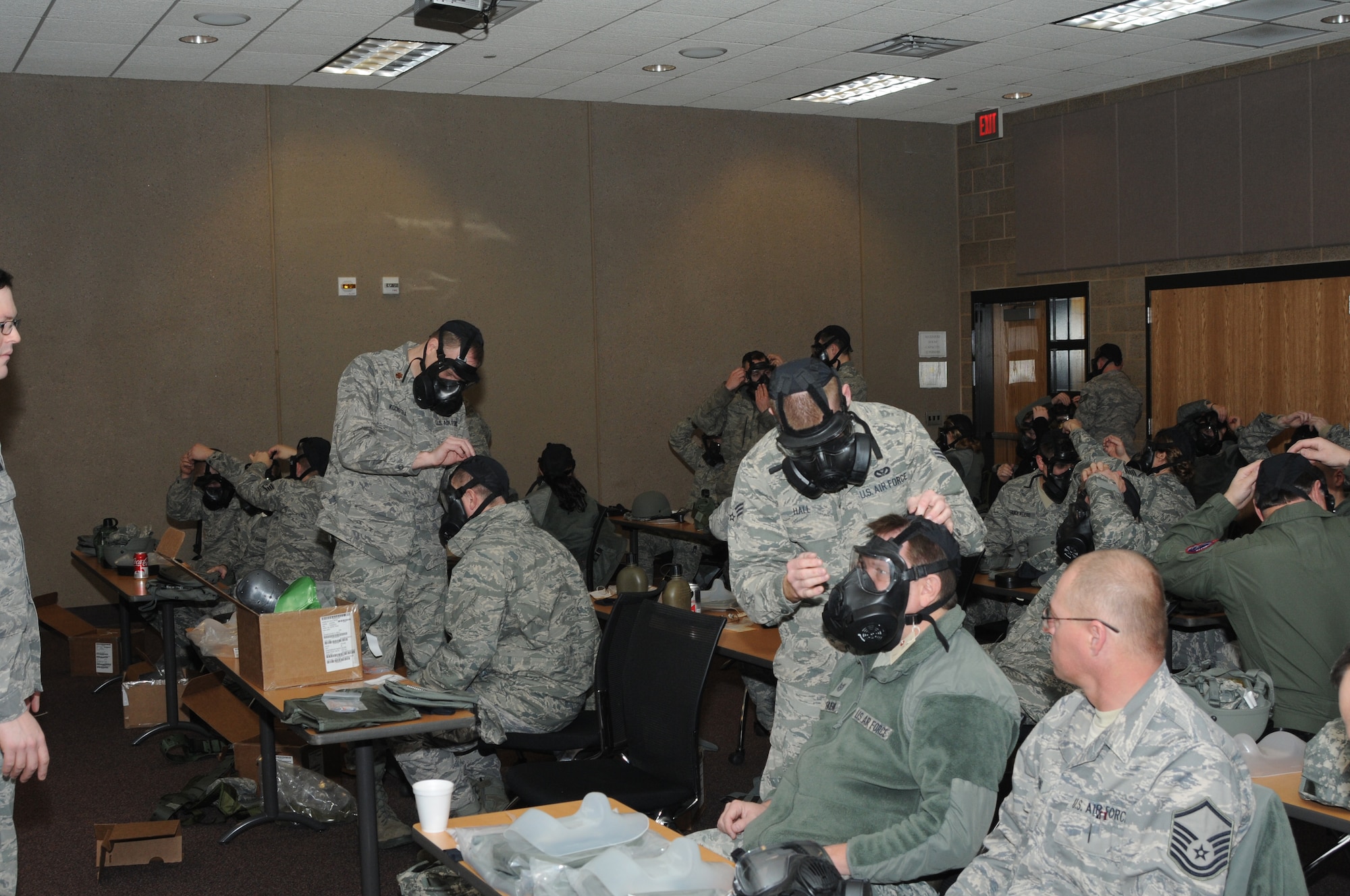 SIOUX FALLS, S.D. -- Members of the South Dakota Air National Guard helped wingmen adjust their new gas masks to attain a proper seal during training for their new M-50 Joint Services General Purpose Gas Mask January 6th 2013.(National Guard photo by Master Sgt. Christopher Stewart)(Released)