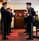 Honor Guardsmen from Barksdale Air Force Base, La., prepare to fold the American flag during a memorial service dedicated to retired Air Force Senior MSgt. Thomas Steward at Hill Crest Memorial Funeral Home, Bossier City, La., Jan. 10. The roles of the Honor Guard include conducting memorial services for deceased veterans and retiring personnel. (U.S. Air Force photo/Airman 1st Class Andrew Moua)