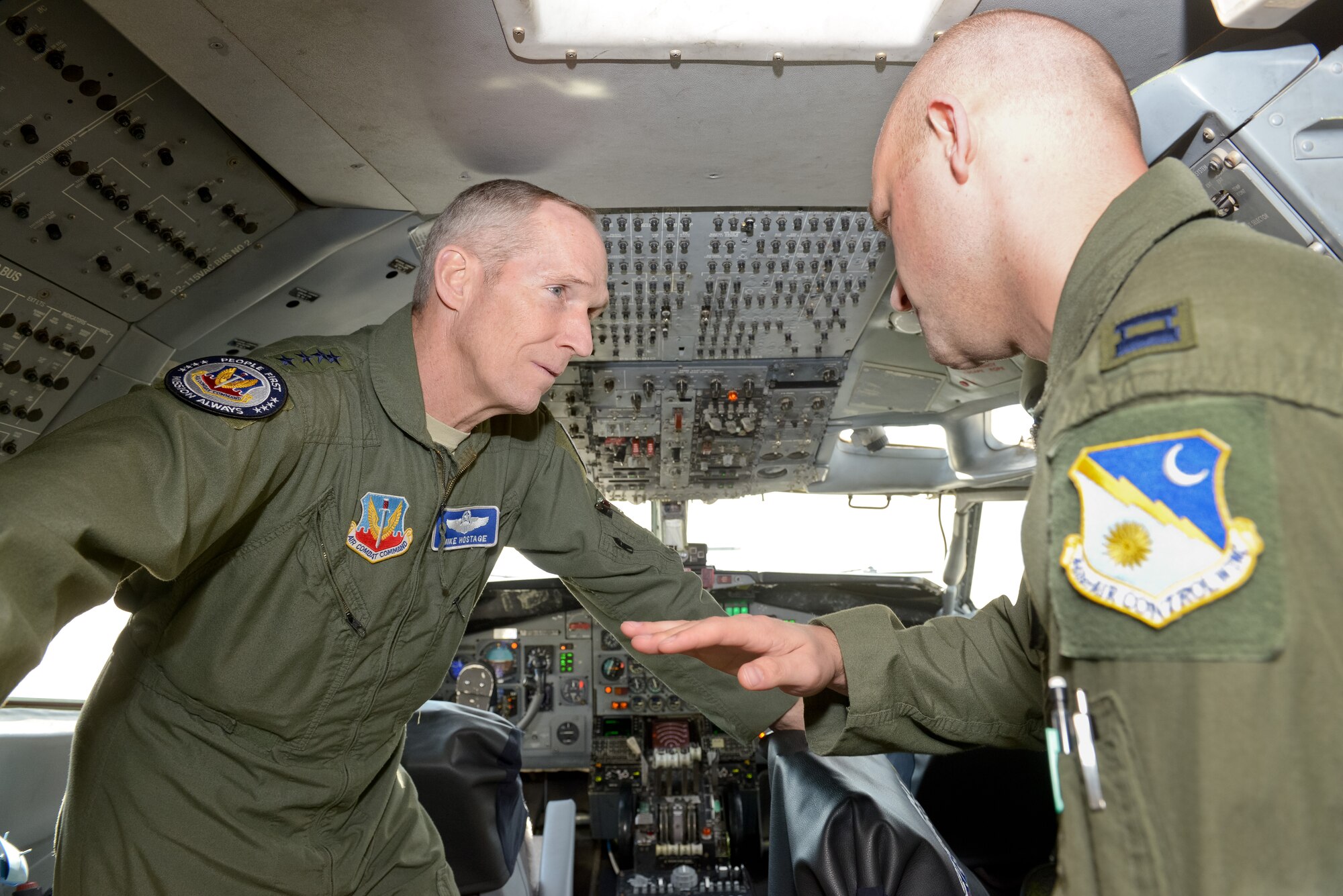 U.S. Air Force Capt. Robert, 16th Airborne Command and Control Squadron, briefs U.S Air Force Gen. Mike Hostage, commander, Air Combat Command, on the flight deck operations of the E-8C Joint STARS at Robins Air Force Base, Ga., Jan. 7, 2013.  Hostage toured the aircraft during a two-day visit to Team JSTARS where he received mission briefs, hands-on JSTARS maintenance demonstrations and conducted an all-call where he awarded the Purple Heart Medal to Air National Guard Tech. Sgt. Barry Duffield from the 116th Civil Engineering Squadron, Explosive Ordnance Disposal Flight. (Last name of the crewmember withheld for security purposes) (National Guard photo by Master Sgt. Roger Parsons/Released)