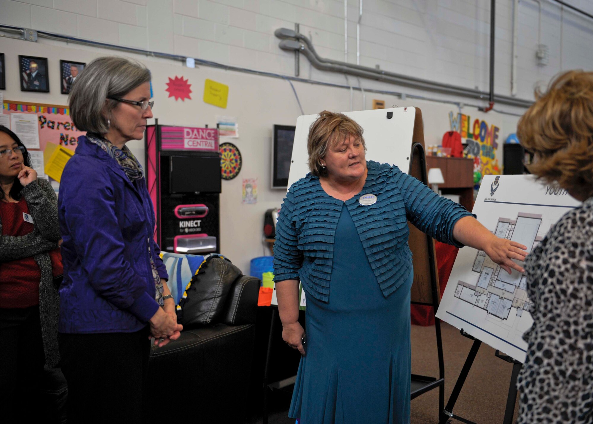 Kathy Hostage, left, wife of U.S. Air Force Gen. Mike Hostage, commander of Air Combat Command, learns about the Team Moody Youth Center from Dawn Coleman, 23d Force Support Squadron deputy, Jan. 8, 2013, at Moody Air Force Base, Ga. Hostage received a tour of several different base facilities that support Airmen and their families. (U.S. Air Force photo by Senior Airman Eileen Meier/Released)