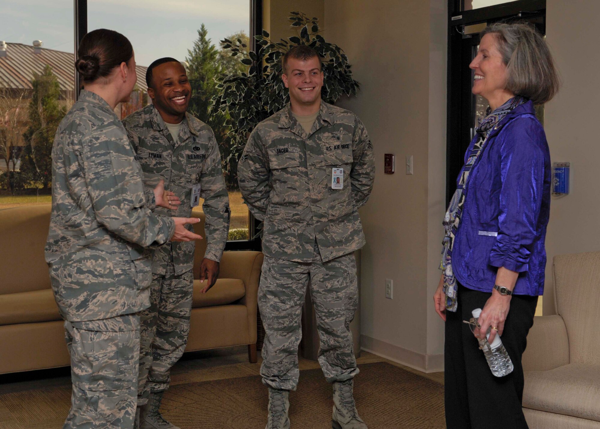 U.S. Air Force Maj. Noreen Marsland, 23d Medical Operations Squadron, introduces Staff Sgt. Ronnie Lyman, 23d MDOS, and Airman 1st Class Jordan Sager, 23d Medical Support Squadron, to Kathy Hostage, wife of Gen. Mike Hostage, commander of Air Combat Command, Jan. 8, 2013, at Moody Air Force Base, Ga.  Hostage toured various facilities to discuss family support issues. (U.S. Air Force photo by Senior Airman Eileen Meier/Released)