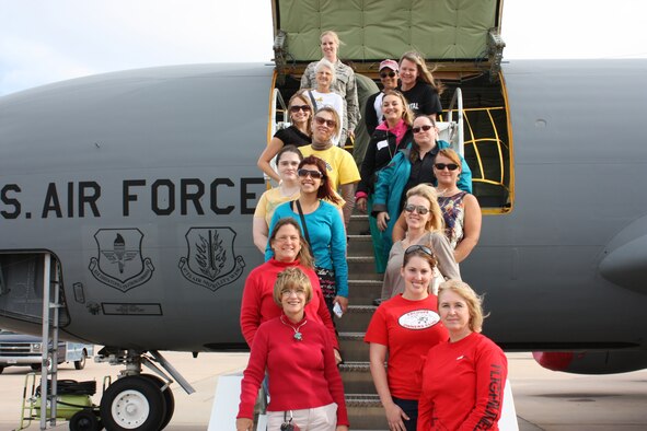 ALTUS AIR FORCE BASE, Okla. – Attendees of the Girls in Flight Training Academy, pose for a picture on the steps of a KC-135 Stratotanker on the flight line Nov. 5, 2012 during a tour of the base. The GIFT Academy provides the opportunity for women to advance and finish their aviation training. During their visit the attendees toured both the C-17 Globemaster III and the KC-135, experienced a full-motion C-17 simulator, as well as a tour of the air traffic control tower. (Courtesy photo)