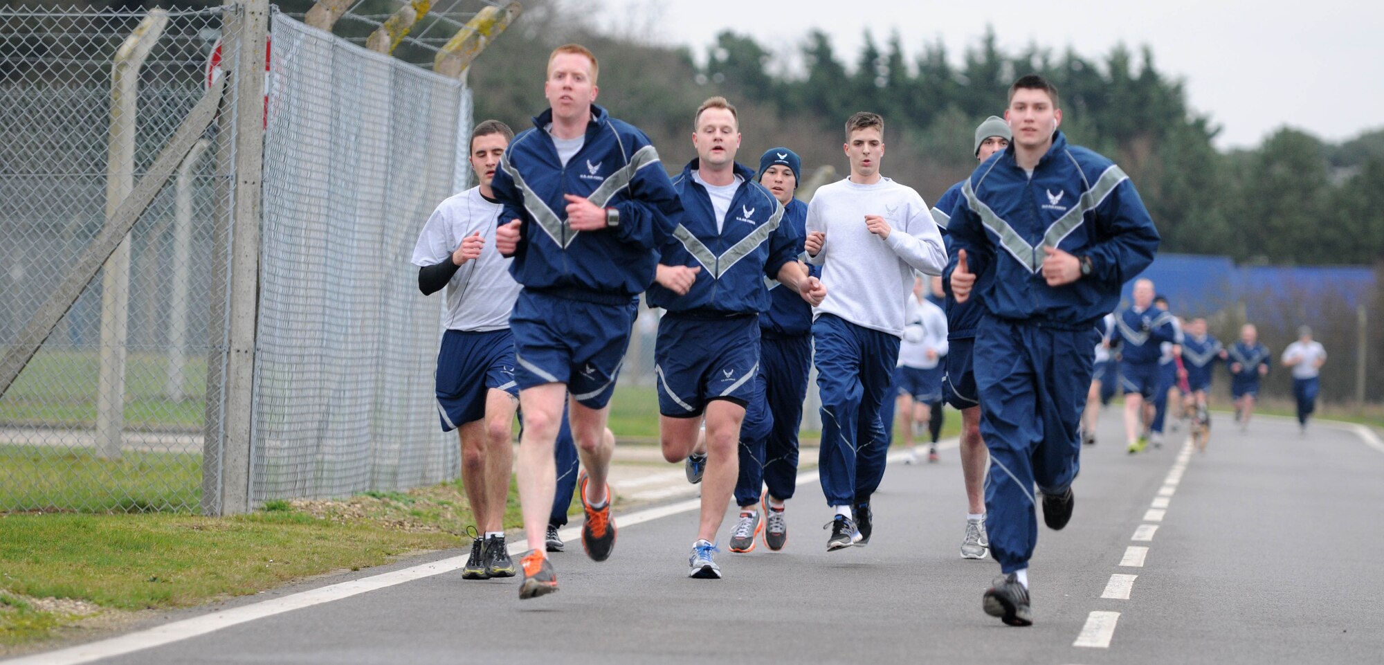 Members of Team Mildenhall approach the final mile of the wing run Jan. 11, 2013, at RAF Mildenhall, England. The monthly 5K run encourages morale and camaraderie throughout the base through exercise and healthy competition. (U.S. Air Force photo by Staff Sgt. Austin M. May/Released)