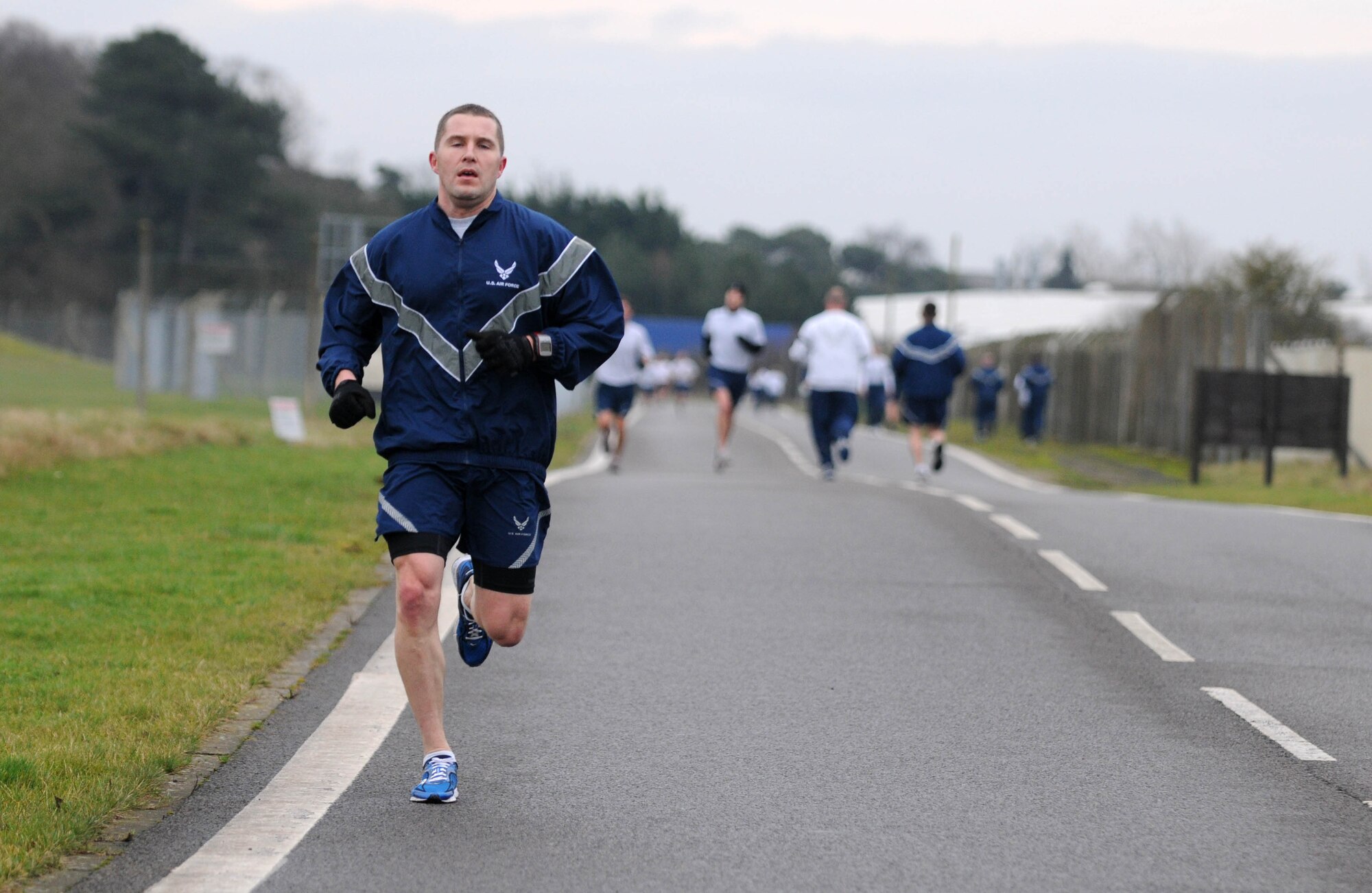 Master Sgt. Brad Walters, 100th Communications Squadron, from Randolph, N.Y., approaches the final mile of the wing run Jan. 11, 2013, at RAF Mildenhall, England. The monthly 5K run encourages morale and camaraderie throughout the base through exercise and healthy competition. Walters was the third overall finisher of the race. (U.S. Air Force photo by Staff Sgt. Austin M. May/Released)