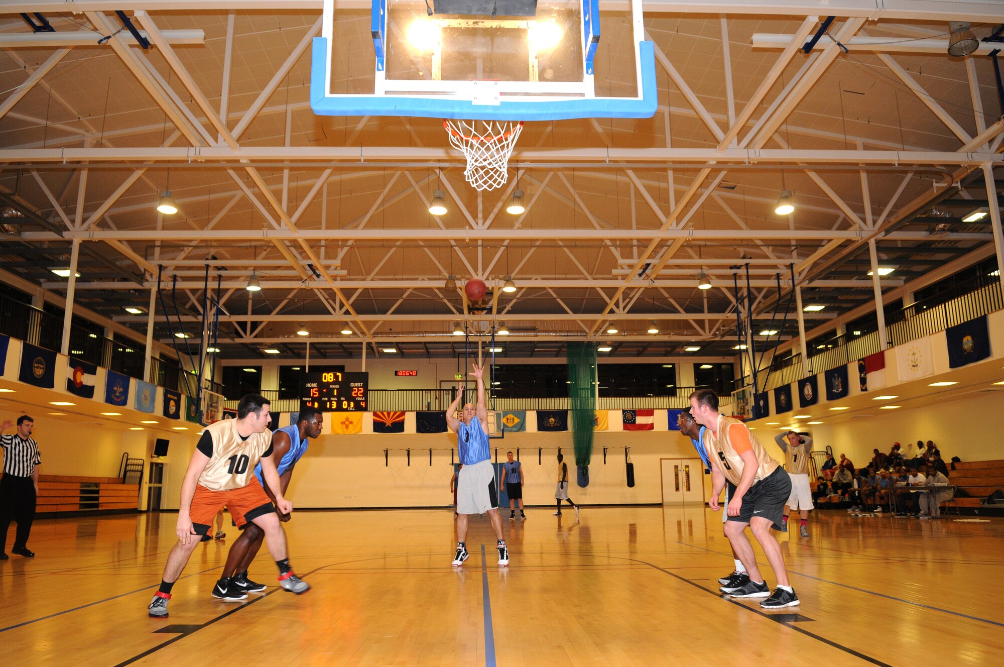 Staff Sgt. Jonel Relojo, 352nd Special Operations Support Squardon logistics planner, shoots a free-throw Jan. 10, 2013, during an intramural basketball game between the 100th Operations Group and the 352nd Special Operations Support Squadron at the Hardstand Fitness Center on RAF Mildenhall, England. The 352nd SOSS were victorious over the 100th OG with a score of 55- 41. (U.S. Air Force photo by Airman 1st Class Dillon Johnston/Released)