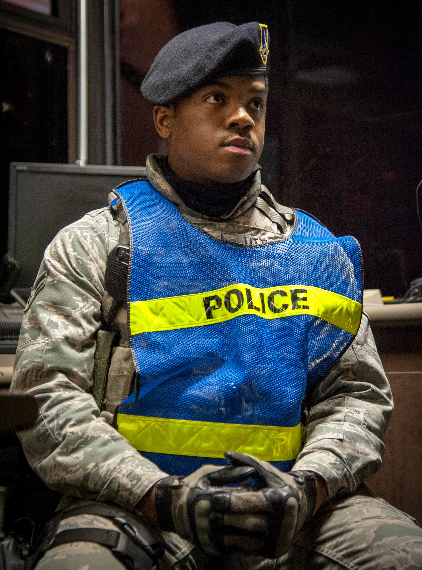 Airman 1st Class James Little, 47th Security Forces Squadron patrolman, answers questions from a public affairs member about his duties as a gate guard at the main gate of Laughlin Air Force Base, Texas, Jan. 7, 2013. No matter what weather conditions are prevailing or what holiday it may be, there will always be a gate guard standing ready year round. (U.S. Air Force photo/Airman 1st Class Nathan Maysonet)