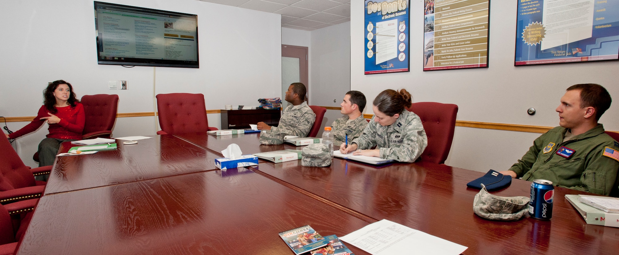 Members of Team McConnell, who will soon depart for a permanent change of station, listen to a briefing during a Smooth Move class at the Airman and Family Readiness Center Dec. 17, 2012, McConnell Air Force Base, Kan. The class gives Airmen a chance to ask any questions they have about their future duty station and the PCS process. (U.S. Air Force photo/Airman 1st Class Victor J. Caputo)
