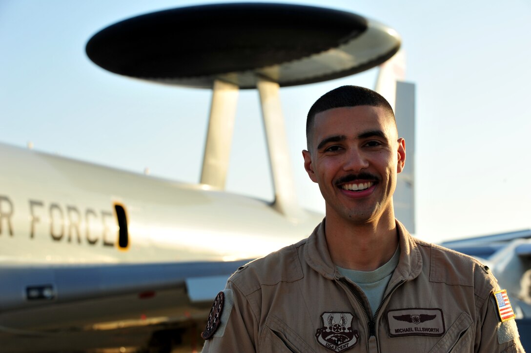 Air Force 1st Lt. Michael Ellsworth poses in front of an E-3 Sentry Jan. 7 in Southwest Asia. Ellsworth’s Sentry was receiving a mid-air refuel when he discovered that his brother was on the other aircraft. (U.S. Air Force photo/ Staff Sgt. Timothy Boyer)