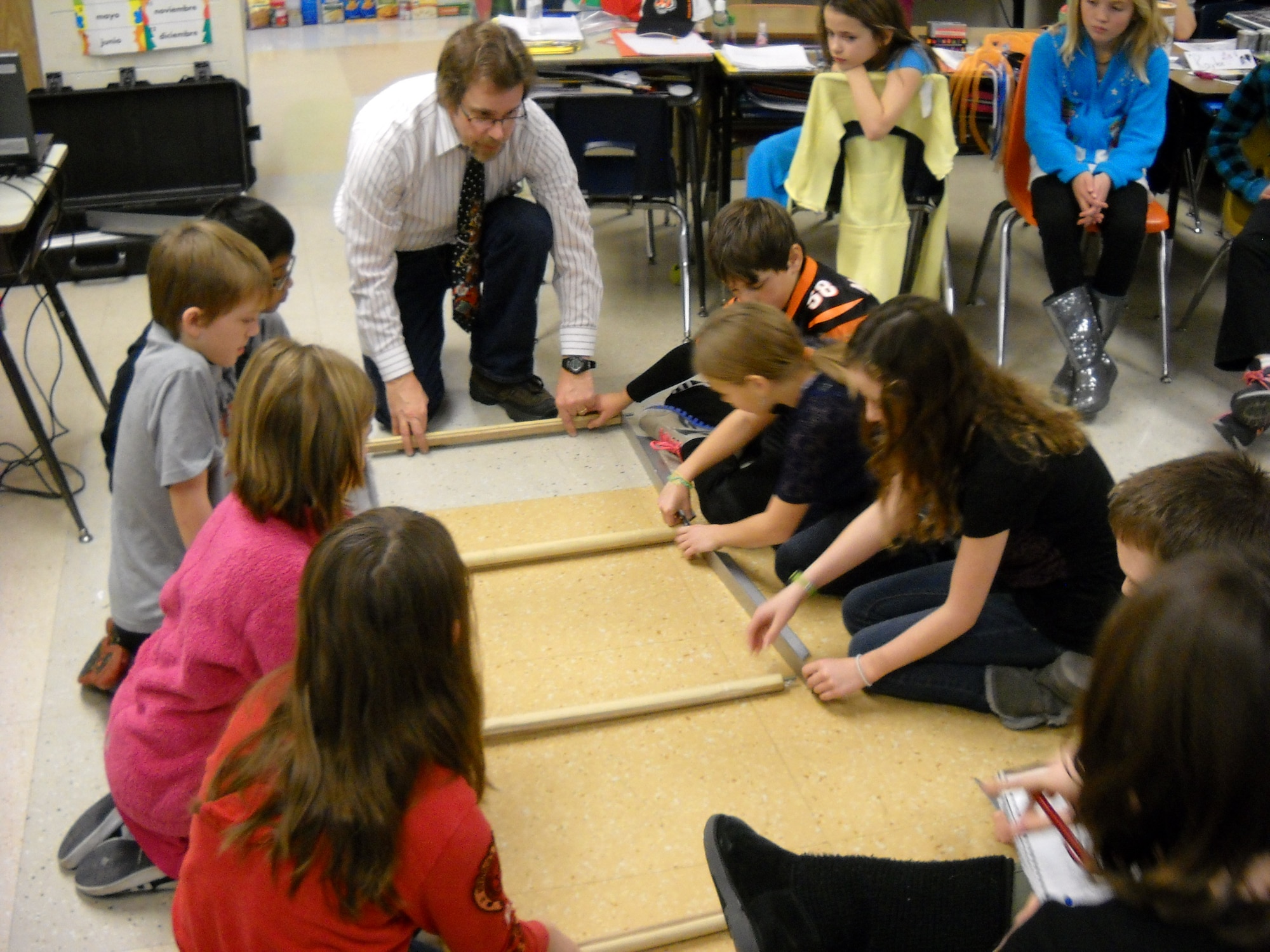 Real science, technology and engineering professionals volunteer their time as “wizards” to bring a wide variety of science demonstrations directly to area classrooms. Demos are aligned with Ohio Curriculum Standards and provide maximum interaction and hands-on experiences for the students. One project is for students to build a bridge together.  (contributed photo)