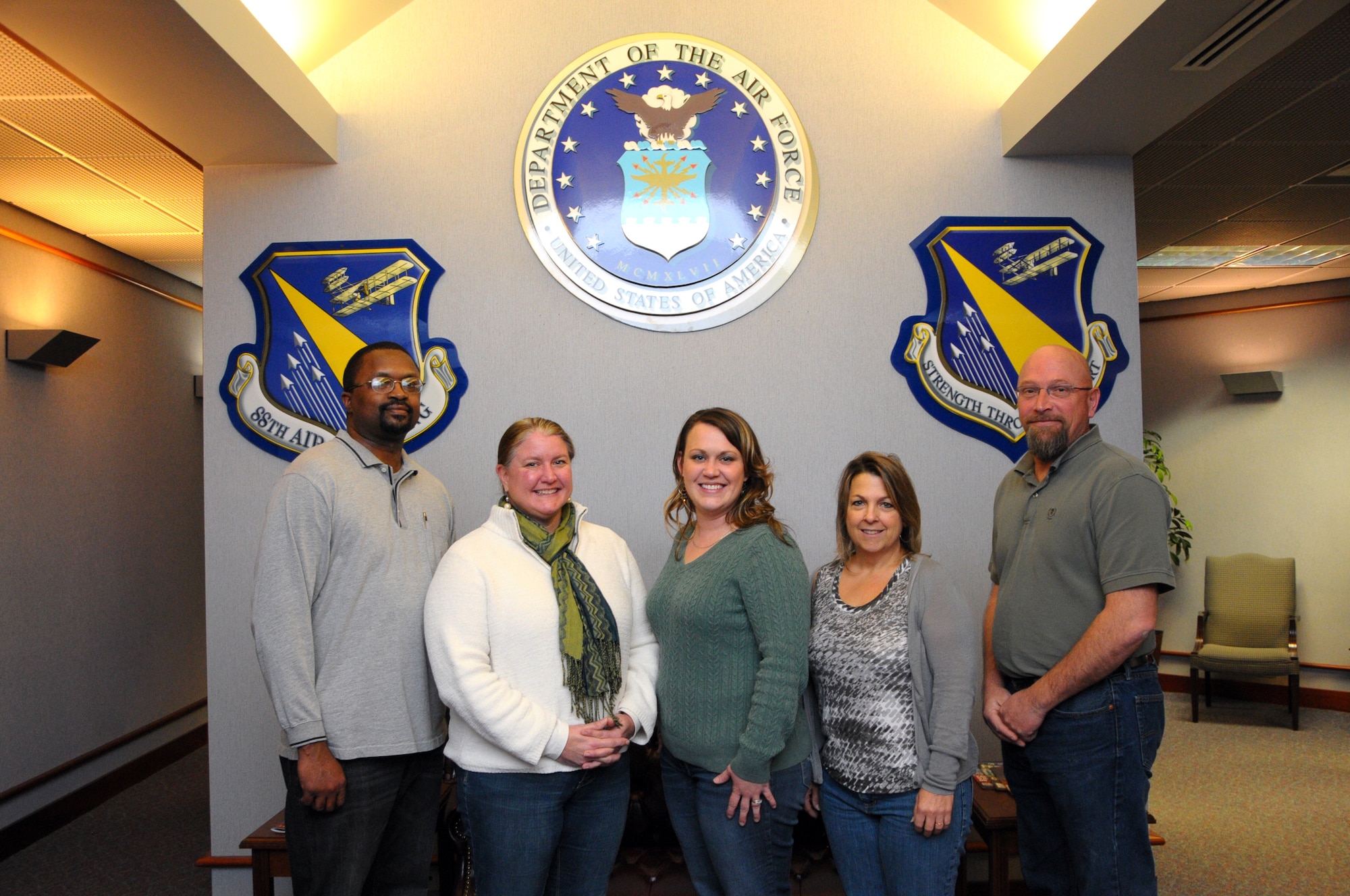 Education and Training Section staff (L-R) Michael Brame, Pamela Riorito, Cara Blair, Deborah McCord and Greg Goodwin have been an active part of the Air Force Materiel Command educational initiatives, the Year of the Community College of the Air Force in 2011 and the Year of Continuing Education in 2012, and are ready to embrace and help promote the third initiative, “Year of the Graduate” in 2013.  (photo by Niki Jahns)