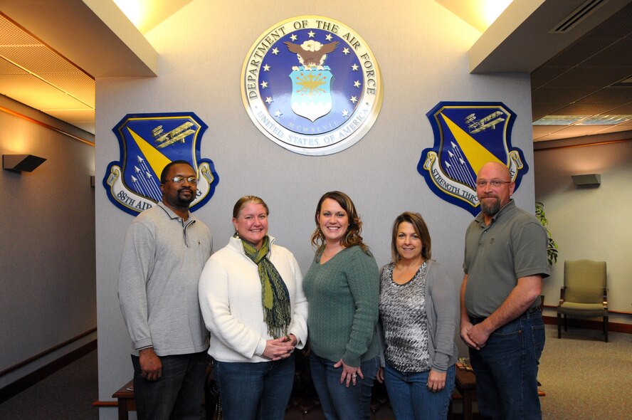 Education and Training Section staff (L-R) Michael Brame, Pamela Riorito, Cara Blair, Deborah McCord and Greg Goodwin have been an active part of the Air Force Materiel Command educational initiatives, the Year of the Community College of the Air Force in 2011 and the Year of Continuing Education in 2012, and are ready to embrace and help promote the third initiative, “Year of the Graduate” in 2013.  (photo by Niki Jahns)