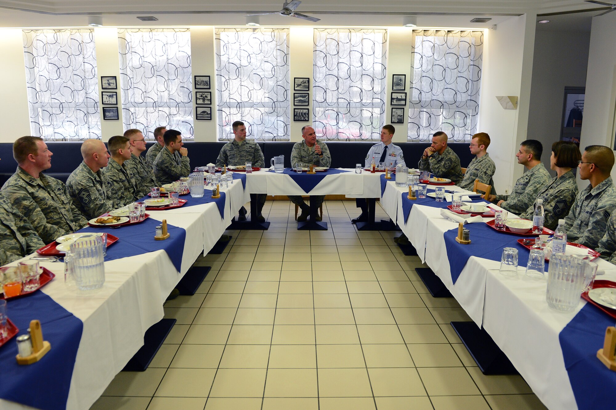 SPANGDAHLEM AIR BASE, Germany – U.S. Air Force Lt. Gen. Craig A. Franklin, center, 3rd Air Force commander, speaks with Airmen of the 52nd Fighter Wing after a lunch at the Mosel Dining Facility, Jan. 10, 2013. Franklin addressed upcoming changes, leadership and creating a successful future for the Air Force. (U.S. Air Force photo by Airman 1st Class Dillon Davis/Released)