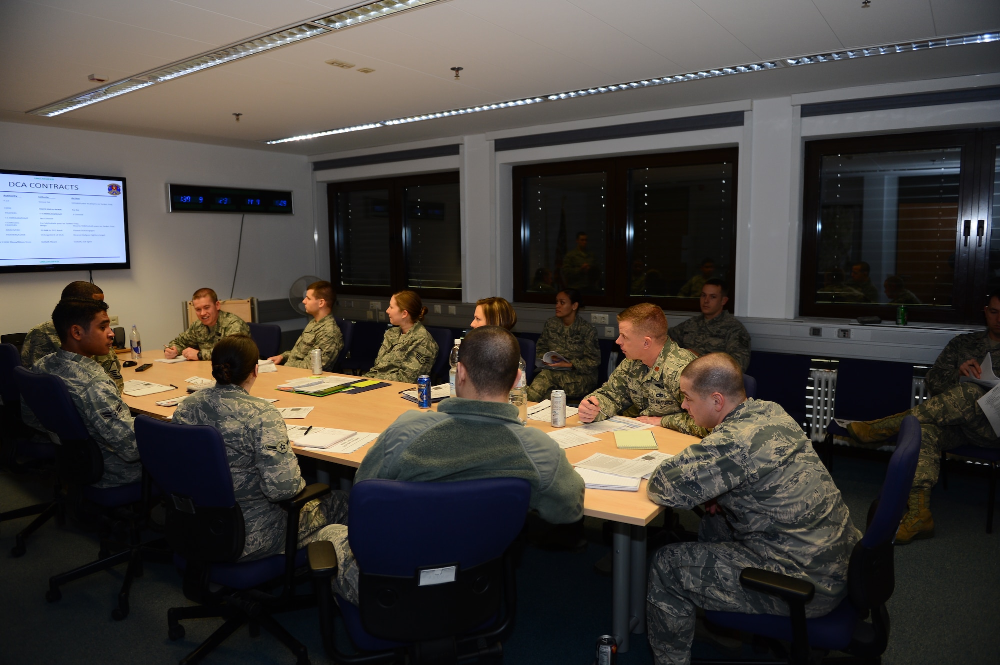 SPANGDAHLEM AIR BASE, Germany – U.S. Air Force Airmen from the 606th Air Control Squadron prepare for a training mission during a group briefing, Jan. 8, 2013. The brief included intelligence, weather and other vital flight information that helps air control personnel effectively fulfill mission taskings during their upcoming training at Red Flag 13-2. (U.S. Air Force photo by Airman 1st Class Dillon Davis/Released)