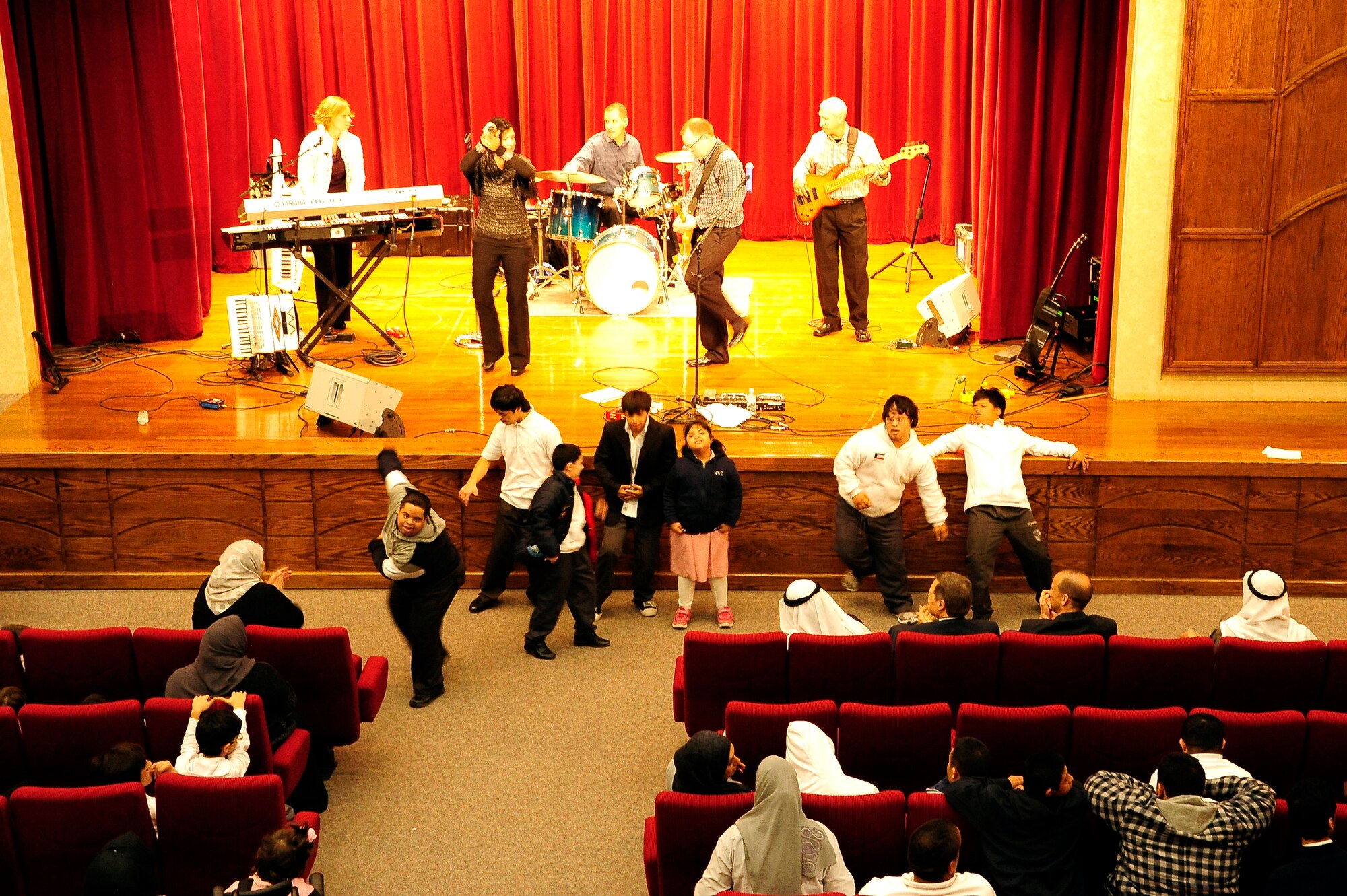 U.S. Air Forces Central Command Band "Total Force", entertains children and adults at a Day Care Center in Southwest Asia Jan. 6, 2012. The band is touring the region providing music and entertainment for deployed service members and host nation communities.  (U.S. Air Force photo by Staff Sgt. Nicole Manzanares) 