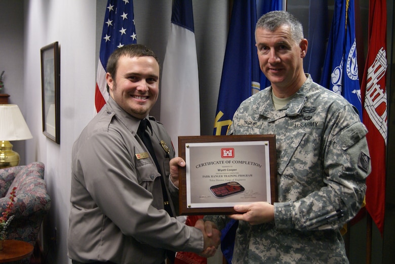 Park ranger Wyatt Cooper from Big Hill Lake, Kansas is presented his certificate. 