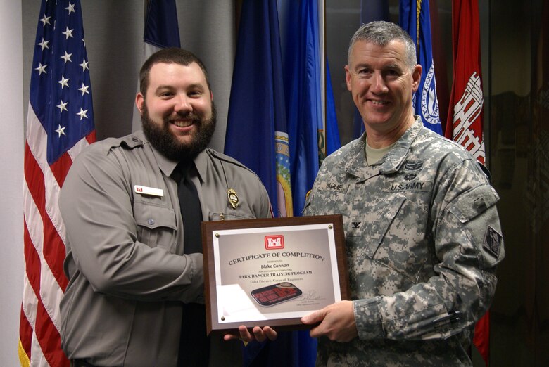Park Ranger Blake Cannon from Hugo Lake receives his certificate from Col. Michael Teague