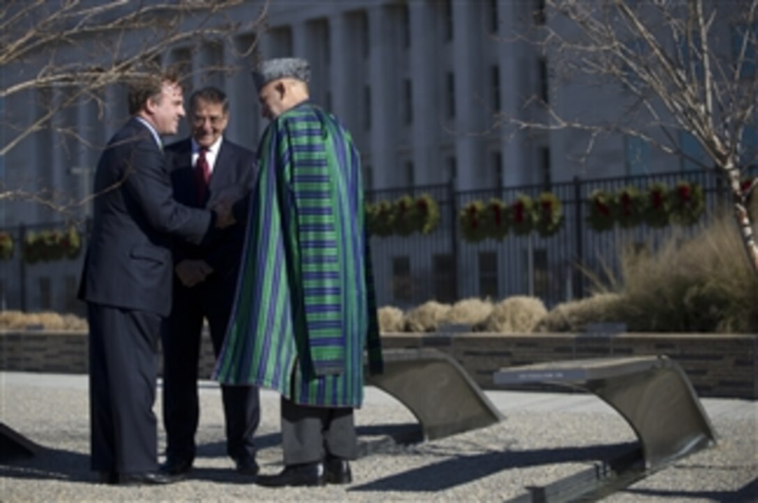 Afghanistan's President Hamid Karzai, right, and Secretary of Defense Leon E. Panetta, center, thank Jim Laychak for the tour of the Pentagon Memorial on Jan. 10, 2013.  Panetta earlier hosted a full honors arrival ceremony to welcome Karzai to the Pentagon.  Panetta, Karzai and their senior advisors then met to discuss national security items of interest to both nations.  Laychak is the president of the Pentagon Memorial Fund.  