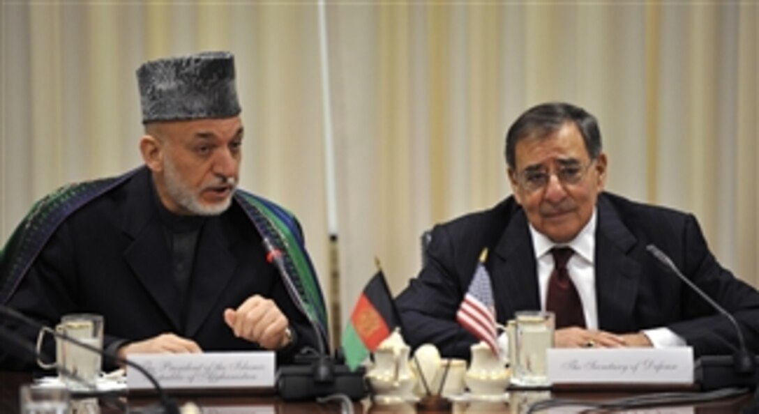 Afghanistan's President Hamid Karzai, left, makes his opening statement at the top of a meeting with Secretary of Defense Leon E. Panetta, right, and their senior advisors in the Pentagon on Jan. 10, 2013.  Panetta, Karzai and their senior advisors are meeting to discuss national security items of interest to both nations.  