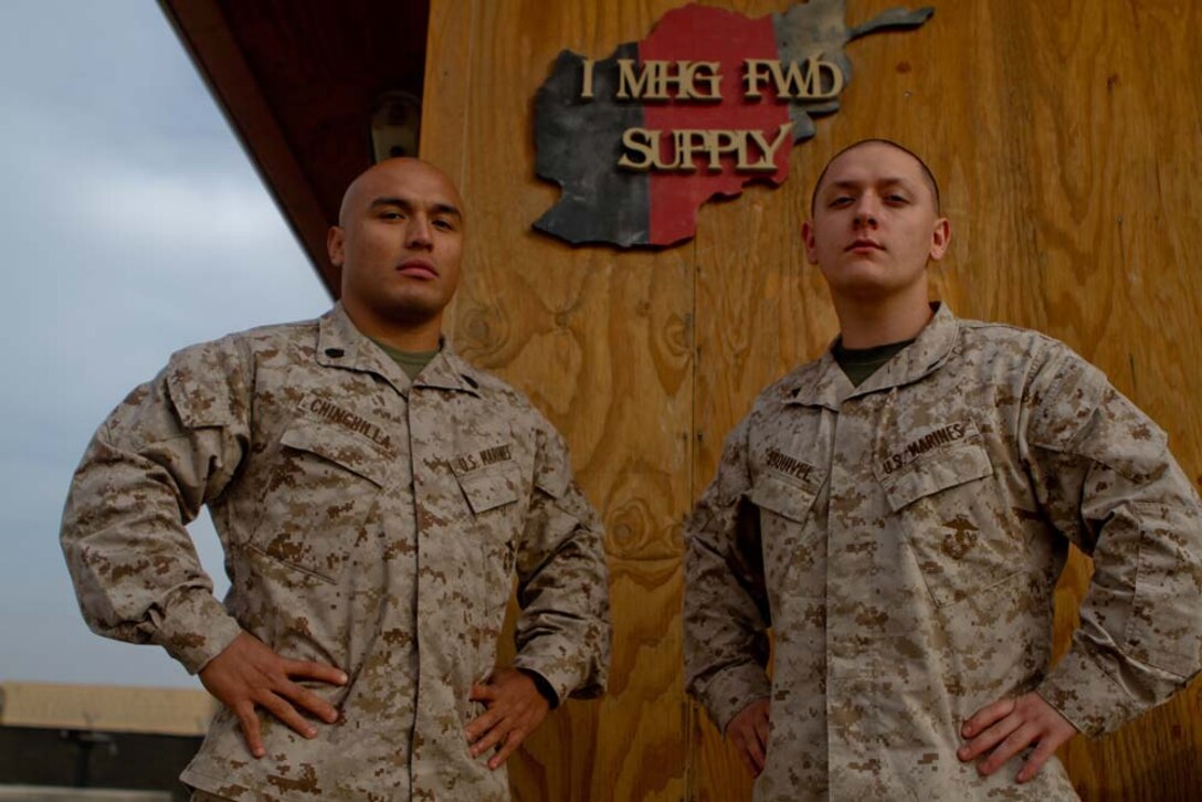 Staff Sgt. Jhonnatan Chinchilla, left, supply chief, and Lance Cpl. Matthew Esquivel, theater provided equipment chief, both with I Marine Expeditionary Force Headquarters Group (Forward), were part of a supply shop of 10 Marines. The shop retrograded more than 800 million pieces of equipment during their yearlong deployment.