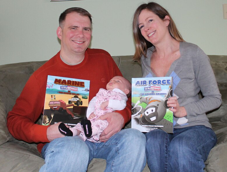 Maj. Johnathan Edmonds and his family show off their first two books in the Service Pals series. Edmonds and his wife wrote military-centric children's books in 2012 and took deliver of the first two editions in mid-January 2013. (USAF courtesy photo)