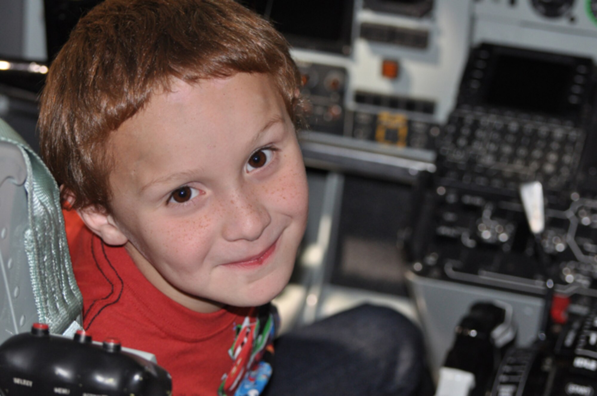 Benjamin, a special tour participant here in January, beams while sitting in the cockpit of a KC-135R Stratotanker. (USAF photo by Maj. Shsnnon Mann, 916ARW/PA)