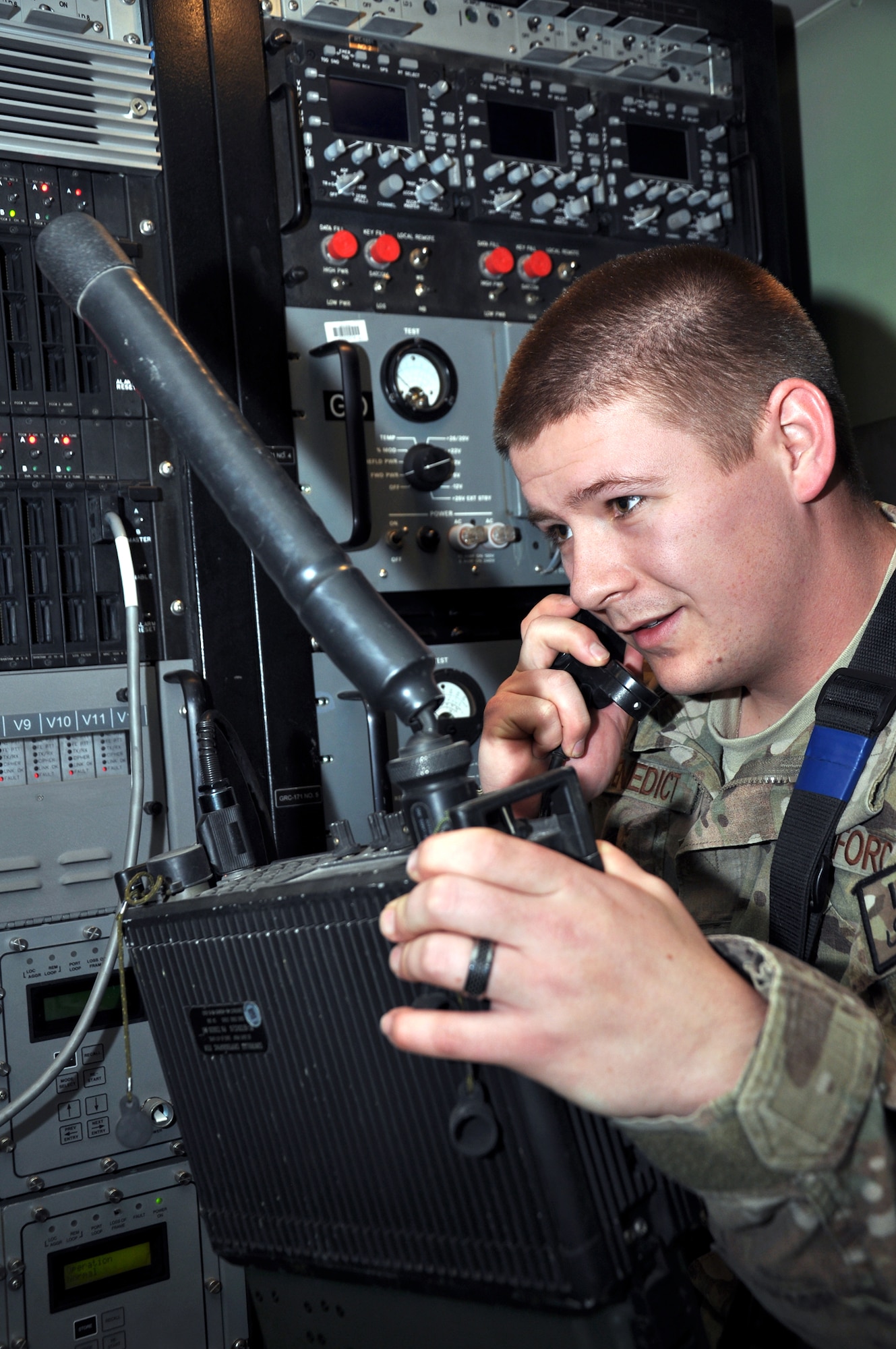 Airman 1st Class Joseph Benedict, 73rd Expeditionary Air Control Squadron RF-transmission systems specialist, tests send and receive functions using a PSC5 transmitter. The radio and equipment that is operated and maintained by the 73rd EACS provides tactical communication and support between soldiers in the field and Airmen providing overwatch in the skies above Afghanistan. (U.S. Air Force photo/Master Sgt. Russell Martin)