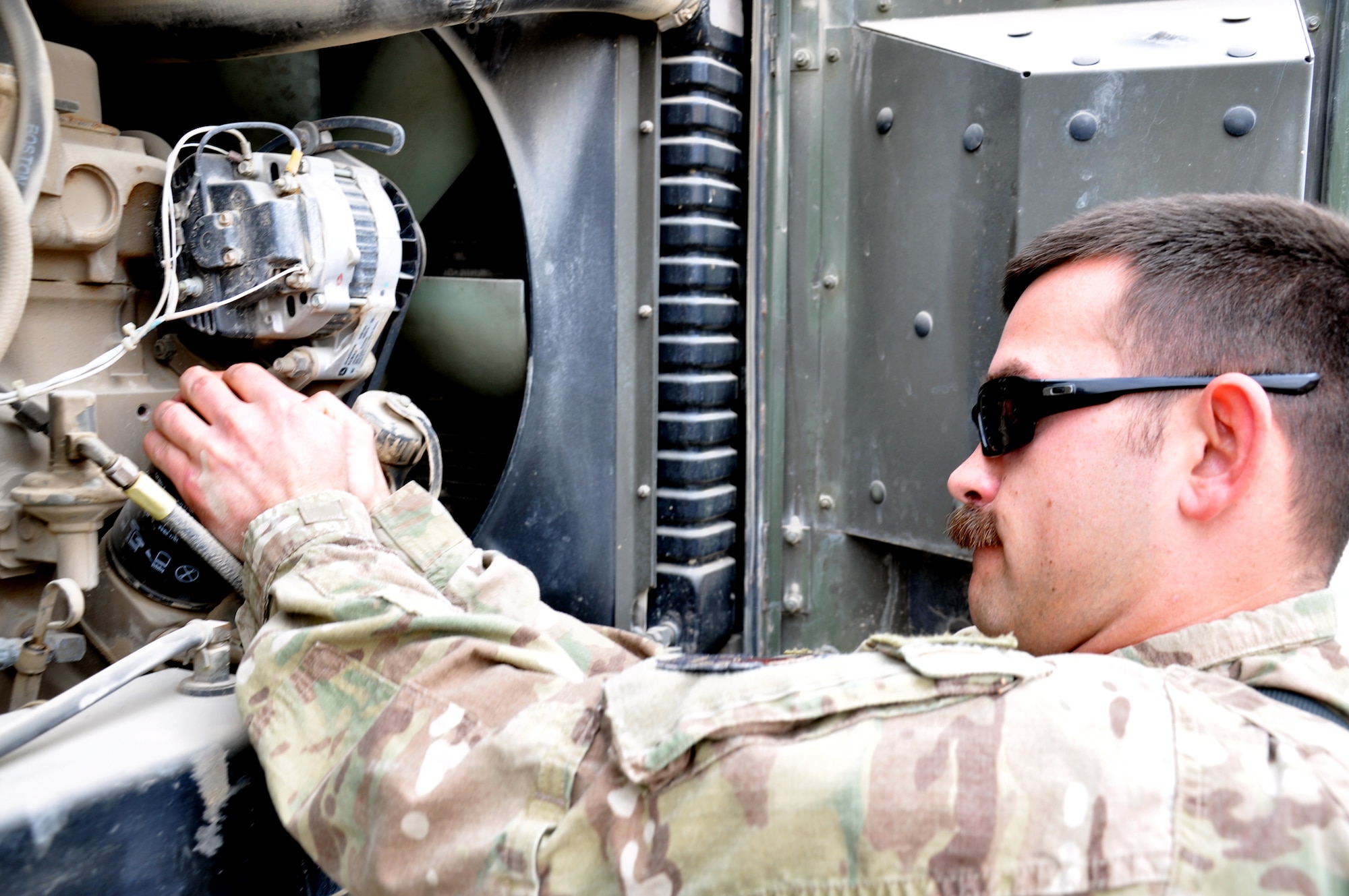 Senior Airman James Brandt, 73rd Expeditionary Air Control Squadron power-production specialist removes an oil filter in an MEP-806 generator. The generator and others like it are used to power many of the systems at Camp Palomino here where the 73rd EACS operates. Outside the wire, power-production is instrumental in ensuring forces can operate their communication equipment and maintain constant contact with soldiers on the battlefield. (U.S. Air Force photo/Master Sgt. Russell Martin)