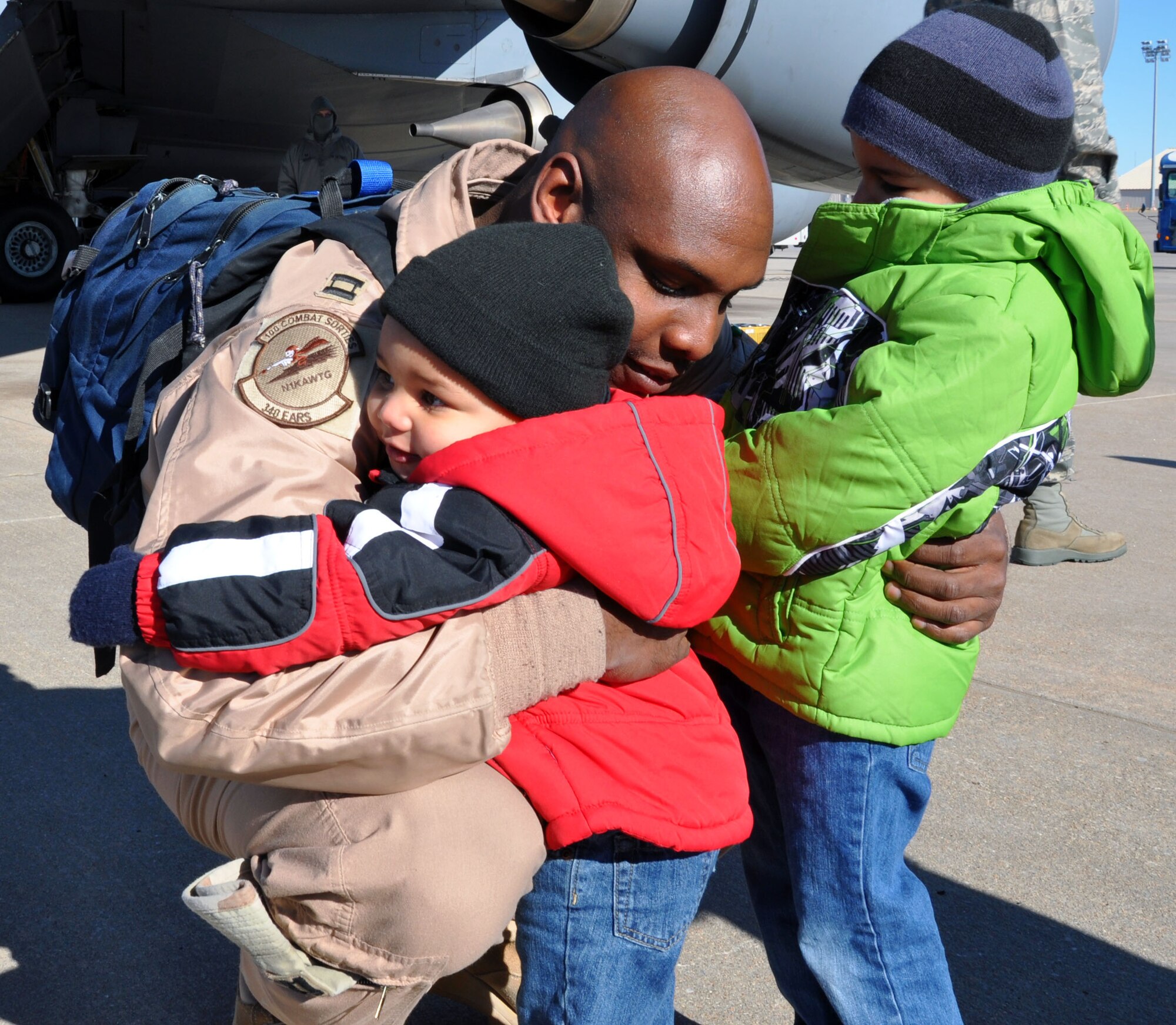 Capt. Will Watson, a pilot assigned to the 931st Air Refueling Group, greets his family on the flightline at McConnell Air Force Base, Kan., Jan. 13, 2013.  Watson had just returned from a deployment to Southwest Asia.  (U.S. Air Force photo by 1st Lt. Zach Anderson)