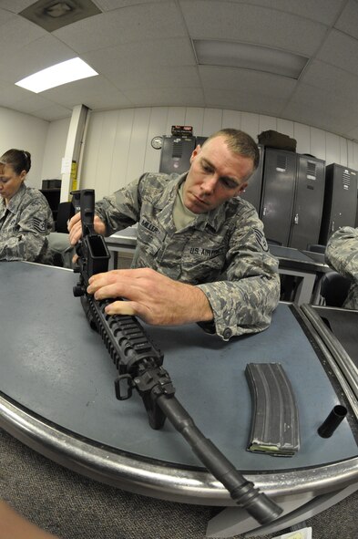 Staff Sgt. Dustin Miller, 442nd Civil Engineers Squadron learns weapons re-assembly during classroom training Jan. 12, 2013. Approximately 25 reservists from the 442nd CES are scheduled to deploy in March in support of Operation Enduring Freedom. The 442nd Civil Engineers Squadron is part of the 442nd Fighter Wing, an A-10 Thunderbolt II Air Force Reserve unit at Whiteman Air Force Base, Mo. (U.S. Air Force photo by Tech. Sgt. Danielle Johnston)