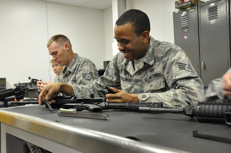 Senior Airman Deshawn Stallworth, 442nd Civil Engineers Squadron learns weapons disassembly during classroom training Jan. 12, 2013. Approximately 25 reservists from the 442nd CES are scheduled to deploy in March in support of Operation Enduring Freedom. The 442nd Civil Engineers Squadron is part of the 442nd Fighter Wing, an A-10 Thunderbolt II Air Force Reserve unit at Whiteman Air Force Base, Mo. (U.S. Air Force photo by Tech. Sgt. Danielle Johnston)