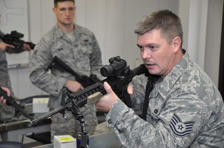 Tech. Sgt. Michael Boessen, 442nd Security Forces Squadron combat arms instructor, teaches civil engineers field movements during classroom training Jan. 12, 2013. Approximately 25 reservists from the 442nd CES are scheduled to deploy in March in support of Operation Enduring Freedom. The 442nd Civil Engineers Squadron is part of the 442nd Fighter Wing, an A-10 Thunderbolt II Air Force Reserve unit at Whiteman Air Force Base, Mo. (U.S. Air Force photo by Tech. Sgt. Danielle Johnston)