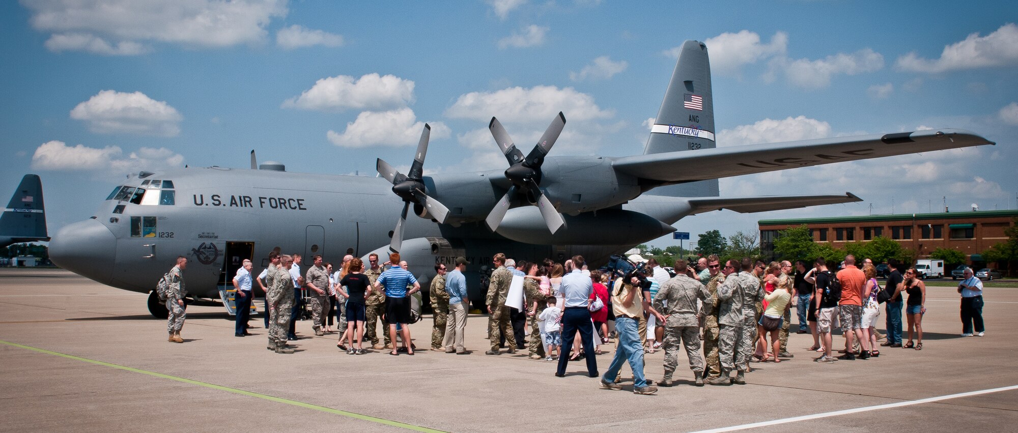 Friends and family members welcome home a dozen members of the 123rd Special Tactics Squadron on the flight line of the Kentucky Air National Guard Base in Louisville, Ky., May 5, 2012. The Airmen spent six months in Afghanistan in support of Operation Enduring Freedom. (U.S. Air Force photo by Senior Airman Maxwell Rechel)