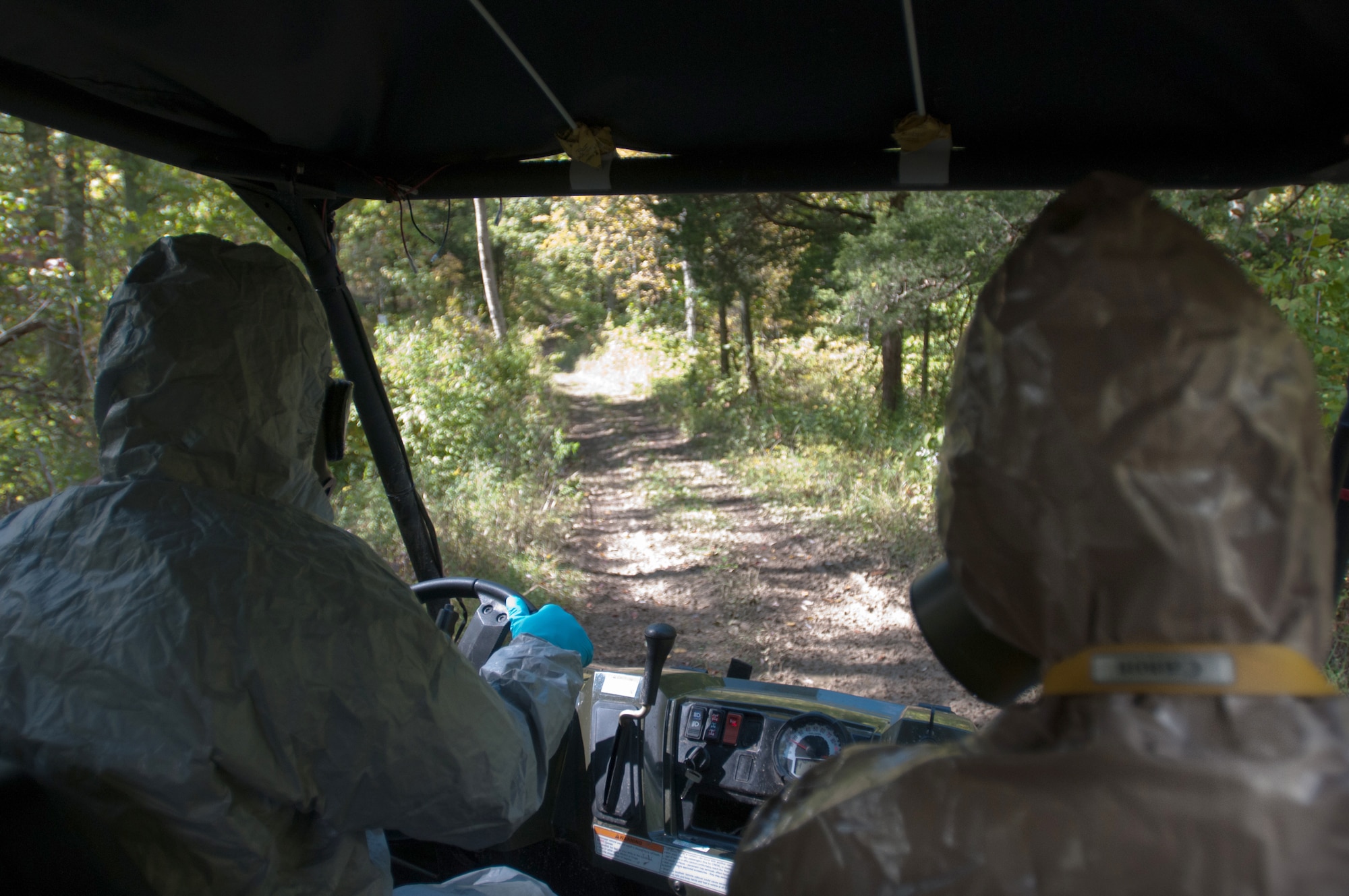 Members of the Kentucky National Guard's 41st Civil Support Team drive through the woods to a cabin where suspected bomb making substances are present during a U.S. Army North exercise on Oct. 2, 2012, in Frankfort, Ky. (Kentucky Air National Guard photo by Master Sgt. Phil Speck)