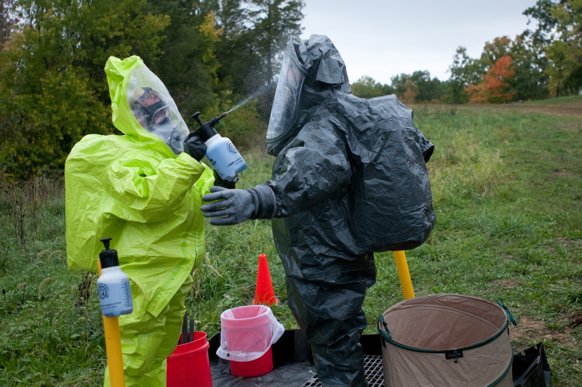 Kentucky Army National Guard Sgt. 1st Class Michael Davis, decontamination NCOIC for the 41st Civil Support Team, conducts decontamination procedures for Kentucky Air National Guard Staff Sgt. Joe Cloutier, a survey team member, as Cloutier returns from operations in the "hot zone” at a U.S. Army North exercise on Oct. 2, 2012, in Frankfort, Ky. (Kentucky Air National Guard photo by Master Sgt. Phil Speck)