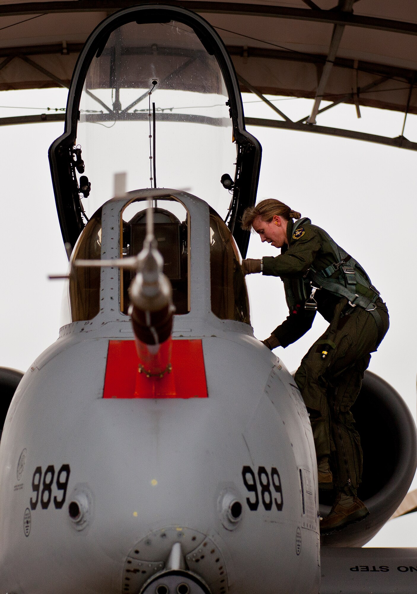 Maj. Olivia Elliott, of the 40th Flight Test Squadron, climbs into her A-10 Thunderbolt II prior to a test mission Jan. 10 at Eglin Air Force Base, Fla.  Her mission was to wrap up flight testing of the new Net-T software upgrade on the LITENING II advanced targeting pod.  The new upgrade allows the pod to provide ground forces beyond-line-of-sight command and control capabilities as long as the aircraft is within range.  This is the first-ever test of this new capability.   (U.S. Air Force photo/Samuel King Jr.)
