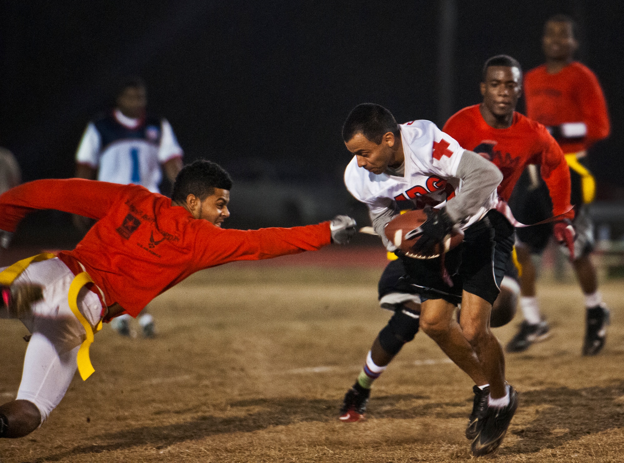 The 96th Medical Group’s Andrew Salas dodges a Contracting Team defender on one of his many runs during the base intramural championship game Jan. 9 at Eglin Air Force Base, Fla.  The Medical Group won easily 33-16. (U.S. Air Force photo/Samuel King Jr.)
