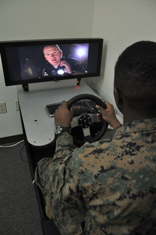 Private First Class Folson Fairley-Baker, a supply clerk aboard Marine Corps Logistics Base Barstow uses a virtual driving simulator offered at Headquarters Battalion's 'back in the saddle training' held January 7 at the Maj. General James L. Day Conference Center aboard the base. During the class, volunteers were given the chance to drive using the program to simulate the effects of driving under the influence or while being distracted.