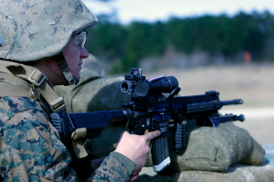 A student with Company D, Infantry Training Battalion – East looks down range after firing the M27 Infantry Automatic Weapon aboard Marine Corps Base Camp Lejeune Jan. 9. The IAR is meant to replace the M249 Squad Automatic Weapon, giving Marines a lighter, more precise weapon to use while deployed. 