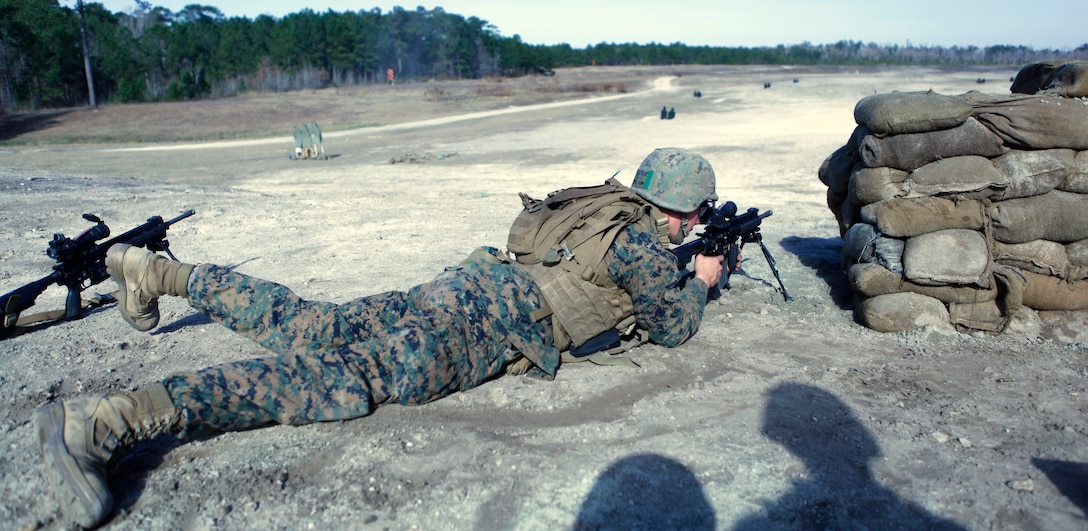 A student with Company D, Infantry Training Battalion – East lies in the prone position while firing the M27 Infantry Automatic Weapon aboard Marine Corps Base Camp Lejeune Jan. 9. Students had the chance to fire the weapon in the prone, kneeling and standing positions, and they fired the IAR both on semi-automatic and fully automatic.