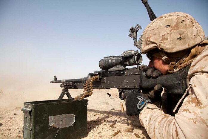 U.S. Marine Corps Sgt. Daniel J. Vansittere, a rifleman assigned to Police Advisory Team 5, 2nd Battalion, 7th Marine Regiment (2/7), fires a M240B machine gun while conducting live fire training near Combat Outpost Now Zad, Helmand province, Afghanistan, Dec. 29, 2012. Vansittere, originally from Ozarks, Mo., deployed to Afghanistan with 2/7 in support of Operation Enduring Freedom.  (U.S. Marine Corps photo by Cpl. Alejandro Pena/Released)