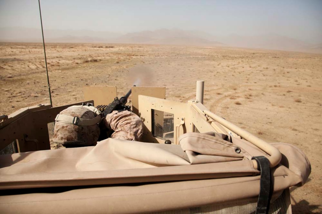A U.S. Marine assigned to Police Advisory Team 5, 2nd Battalion, 7th Marine Regiment (2/7) conducts live fire training near Combat Outpost Now Zad, Dec. 29, 2012. The Marines of 2/7 conducted live fire training to maintain operational readiness and proficiency. (U.S. Marine Corps photo by Cpl. Alejandro Pena/Released)