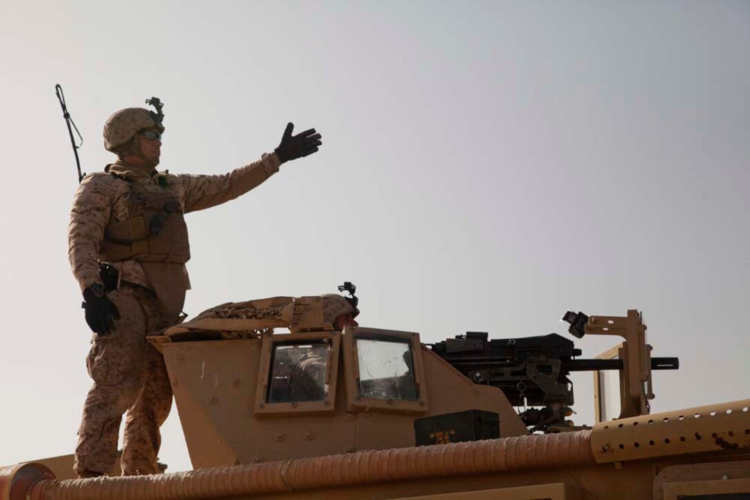 U.S. Marine Corps Sgt. Daniel J. Vansittere, left, directs Lance Cpl. Randolph E. Belcher while conducting live fire training near Combat Outpost Now Zad, Helmand province, Afghanistan, Dec. 29, 2012. Vansittere and Belcher, from Ozarks, Mo. and LaGrange, Ga., respectively, are both assigned to Police Advisory Team 5, 2nd Battalion, 7th Marine Regiment, and deployed to Afghanistan in support of Operation Enduring Freedom. (U.S. Marine Corps photo by Cpl. Alejandro Pena/Released)