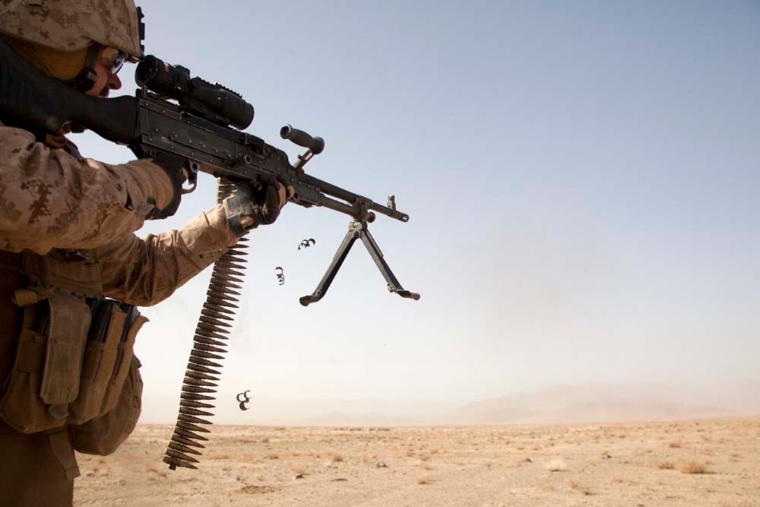 U.S. Marine Corps Capt. Matthew C. Frick, the executive officer for Police Advisory Team 5, 2nd Battalion, 7th Marine Regiment (2/7), fires a M240B machine gun while conducting live fire training near Combat Outpost Now Zad, Helmand province, Afghanistan, Dec. 29, 2012. Flint, originally from St. Louis, Mo., deployed to Afghanistan with 2/7 in support of Operation Enduring Freedom.  (U.S. Marine Corps photo by Cpl. Alejandro Pena/Released)