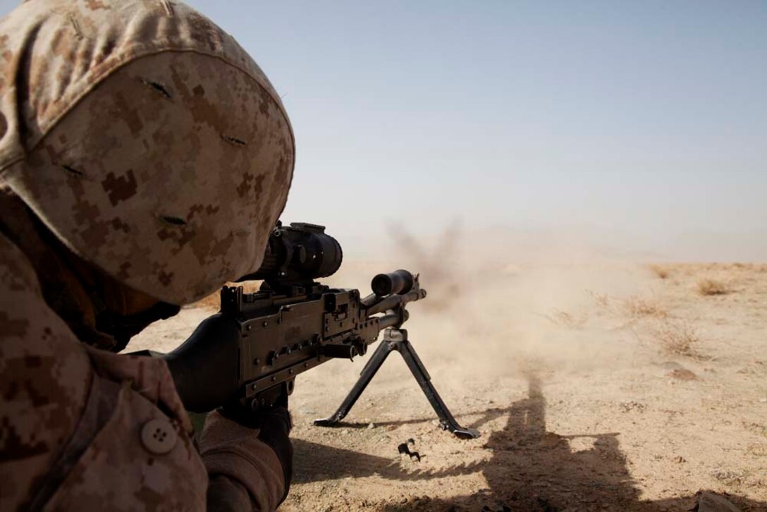 U.S. Marine Corps Capt. Matthew C. Frick, the executive officer for Police Advisory Team 5, 2nd Battalion, 7th Marine Regiment (2/7), fires a M240B machine gun while conducting live fire training near Combat Outpost Now Zad, Helmand province, Afghanistan, Dec. 29, 2012. Flint, originally from St. Louis, Mo., deployed to Afghanistan with 2/7 in support of Operation Enduring Freedom.  (U.S. Marine Corps photo by Cpl. Alejandro Pena/Released)
