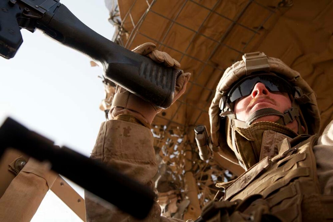 U.S. Marine Corps Cpl. J.A. Carlson, a machine gunner assigned to combined anti-armor team, Fox Company, 2nd Battalion, 7th Marine Regiment (Fox 2/7), provides security prior to conducting live fire training near Combat Outpost Now Zad, Helmand province, Afghanistan, Dec. 29, 2012. The Marines of Fox 2/7 conducted live fire training to maintain operational readiness and proficiency. (U.S. Marine Corps photo by Cpl. Alejandro Pena/Released)