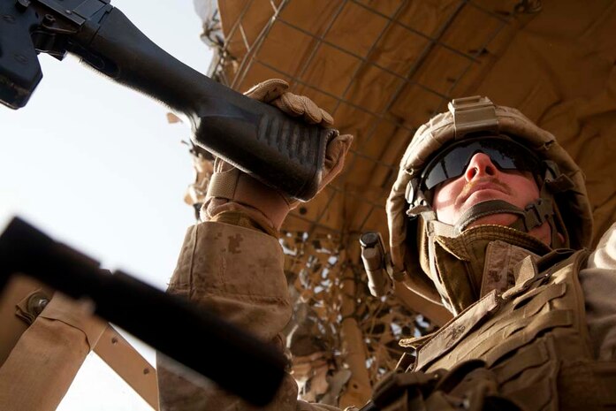 U.S. Marine Corps Cpl. J.A. Carlson, a machine gunner assigned to combined anti-armor team, Fox Company, 2nd Battalion, 7th Marine Regiment (Fox 2/7), provides security prior to conducting live fire training near Combat Outpost Now Zad, Helmand province, Afghanistan, Dec. 29, 2012. The Marines of Fox 2/7 conducted live fire training to maintain operational readiness and proficiency. (U.S. Marine Corps photo by Cpl. Alejandro Pena/Released)